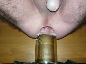 Cum contractions with a very wide bottle deep in my ass.
