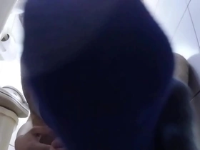 Sweaty blue socks and barefeet in the bathroom
