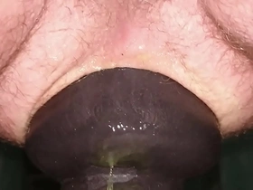 Huge 11cm wide butt plug sliding in my ass on toilet seat up close.